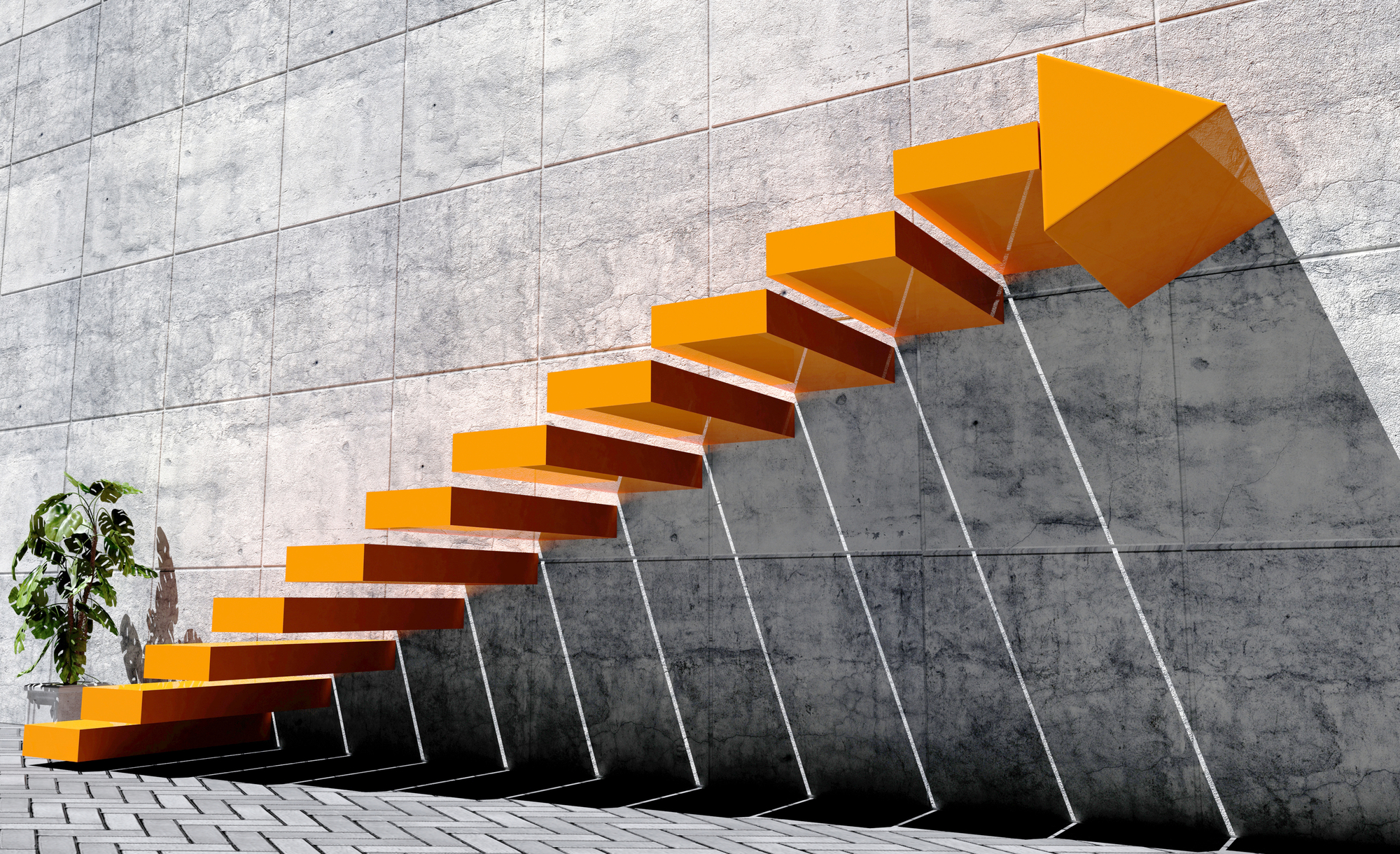 A modern, orange staircase with geometric steps and a large arrow at the top is mounted to a concrete wall. Shadows from the steps create a pattern on the wall. A small potted plant sits on the ground nearby.