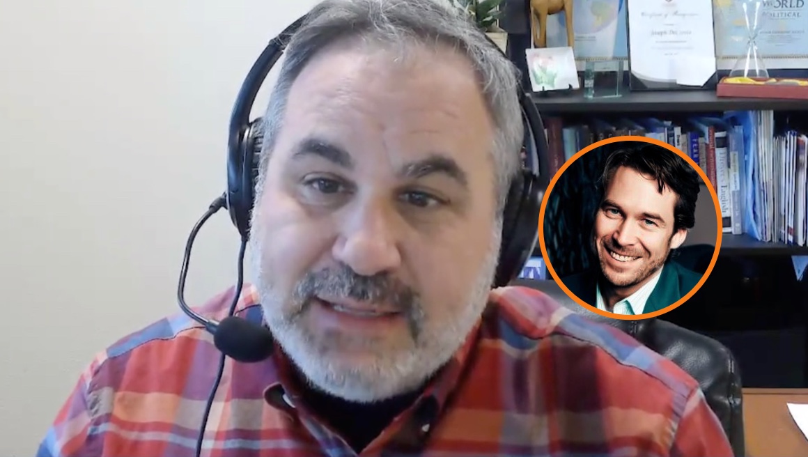 A man with gray hair and a beard wears a headset and red plaid shirt, sitting in an office. Inset is a circular photo of a smiling man in a suit. Shelves with books and awards are visible in the background.